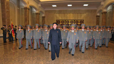This picture taken by North Korea's official Korean Central News Agency (KCNA) on October 10, 2013 shows North Korean leader Kim Jong-Un (C), accompanied by senior army officials, visiting the Kumsusan Palace in Pyongyang to pay tribute to late leaders Kim Il Sung and Kim Jong Il on the occasion of the 68th anniversary of the Workers' Party of Korea (WPK). AFP PHOTO / KCNA via KNS REPUBLIC OF KOREA OUTTHIS PICTURE WAS MADE AVAILABLE BY A THIRD PARTY. AFP CAN NOT INDEPENDENTLY VERIFY THE AUTHENTICITY, LOCATION, DATE AND CONTENT OF THIS IMAGE. THIS PHOTO IS DISTRIBUTED EXACTLY AS RECEIVED BY AFP.---EDITORS NOTE--- RESTRICTED TO EDITORIAL USE - MANDATORY CREDIT 'AFP PHOTO / KCNA VIA KNS' - NO MARKETING NO ADVERTISING CAMPAIGNS - DISTRIBUTED AS A SERVICE TO CLIENTS