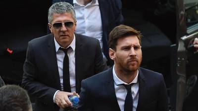 Lionel Messi y su padre Jorge, quien es su agente.