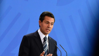 Mexico's President Enrique Pena Nieto wipes sweat from his brow during a signing ceremony among the Pacific Alliance at the Climate Change Conference in Lima, Peru, Wednesday, Dec. 10, 2014. Delegates from more than 190 countries are meeting to work on drafts for a global climate deal that is supposed to be adopted next year in Paris. (AP Photo/Juan Karita)