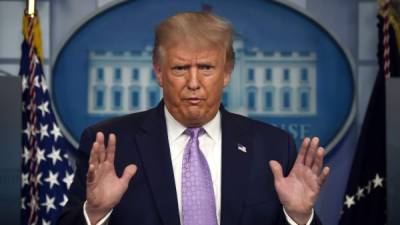 (FILES) In this file photo US President Donald Trump speaks to the press in the Brady Briefing Room of the White House in Washington, DC, on August 5, 2020. - How healthy is Donald Trump, really? Contradictory and incomplete information from officials since the president contracted coronavirus confirms that the health of the White House incumbent is a well-kept secret.Analysts also say Trump has displayed a savvy use of digital tools to try to steer coverage of the first major presidential health crisis of the social media age.Since the October 2, 2020 announcement of Trump's positive test, his personal doctor Sean Conley has been accused of giving fragmented and confusing information that conflicted with what Chief of Staff Mark Meadows was saying. (Photo by Olivier DOULIERY / AFP)