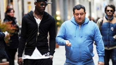 Mario Balotelli y su agente Mino Raiola.