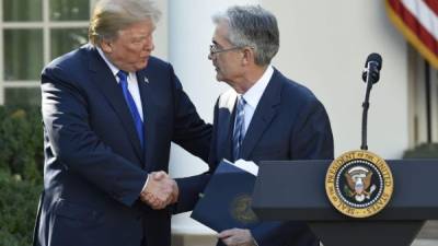 (FILES) In this file photo taken on November 2, 2017, US President Donald Trump walks with Jerome Powell, Federal Reserve chairman, at the White House in Washington, DC. - President Donald Trump resumed his attacks on Federal Reserve Chair Jerome Powell on August 21, 2019, blaming him for keeping the economy from growing much faster.In yet another Twitter screed, Trump said, 'The only problem we have is Jay Powell and the Fed. He's like a golfer who can't putt, has no touch.' (Photo by NICHOLAS KAMM / AFP)
