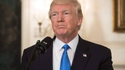 US President Donald Trump delivers a statement in the Diplomatic Room at the White House in Washington, DC, on June 14, 2017 after House Majority Whip Steve Scalise was shot in nearby Alexandria, Virginia.The man who opened fire on Republican lawmakers at a baseball practice early Wednesday, wounding a top congressman and three others, has died of injuries sustained in a shootout with police, President Donald Trump said. 'Many lives would have been lost, if not for the heroic actions of the two Capitol police officers who took down the gunman despite sustaining gunshot wounds during a very, very brutal assault,' Trump said in remarks to the nation. / AFP PHOTO / NICHOLAS KAMM