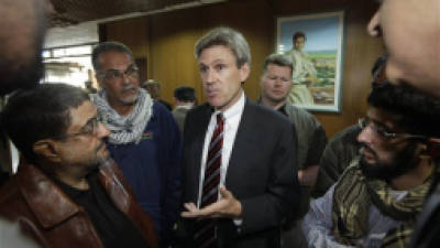 In this photo taken Monday, April 11, 2011, then U.S. envoy Chris Stevens speaks to local media before attending meetings at the Tibesty Hotel where an African Union delegation was meeting with opposition leaders in Benghazi, Libya. Libyan officials say the U.S. ambassador and three other Americans have been killed in an attack on the U.S. consulate in the eastern city of Benghazi by protesters angry over a film that ridiculed Islam's Prophet Muhammad. (AP Photo/Ben Curtis)