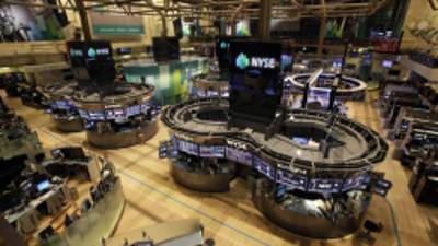 FILE - In this Monday, Oct. 29, 2012 file photo, the floor of the New York Stock Exchange is empty of traders, as New York's financial district braces for the onslaught of Hurricane Sandy. U.S. markets will remain closed Tuesday, Oct. 30, but the New York Stock Exchange said that despite reports that its historic trading floor suffered irreparable damage, no such damage has occurred and that contingency plans are being tested only as a safety measure. Futures trading will go on until 9:15 a.m. Eastern, but volume is light. (AP Photo/Richard Drew, File)