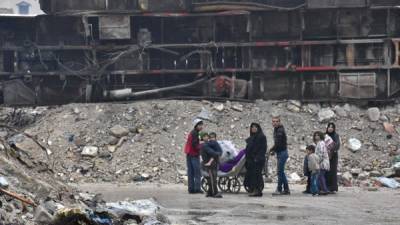 Miles de civiles continúan atrapados en Alepo tras la conquista de la ciudad por las fuerzas del régimen de Asad. AFP.