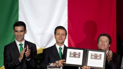 The 'Pop.up next' concept flying car, a hybrid vehicle that blends a self-driving car and passenger drone by Audi, italdesign and Airbus is seen during the first press day of the Geneva International Motor Show on March 6, 2018 in Geneva.The show opens to the public on March 8 and runs through March 18. / AFP PHOTO / Fabrice COFFRINI