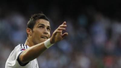 Real Madrid's Cristiano Ronaldo from Portugal celebrates his goal during a Spanish La Liga soccer match against Granada at the Santiago Bernabeu stadium in Madrid, Spain, Sunday, Sept. 2, 2012. (AP Photo/Andres Kudacki)