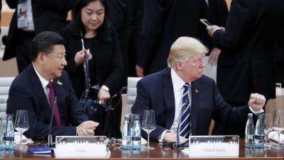 El presidente de China, Xi Jinping junto al mandatario estadounidense Donald Trump.