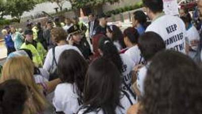 A woman crosses the Rio Bravo with a baby on her arms on the US/Mexico border in Ojinaga, on Feb. 20, 2017, northern Mexico. ***Attention Editors, this image is part of an ongoing AFP photo project documenting the life on the two sides of the US/Mexico border simultaneously by two photographers traveling for ten days from California to Texas on the US side and from Baja California to Tamaulipas on the Mexican side between February 13 and 22, 2017. You can find all the images with the keyword : BORDERPROJECT2017 on our wire and on www.afpforum.com / AFP PHOTO / GUILLERMO ARIAS