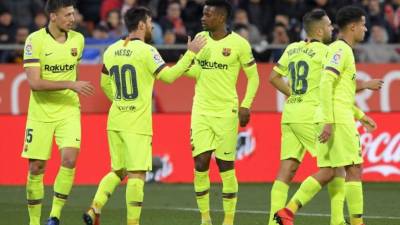 Nelson Semedo y Lionel Messi se encargaron de anotar los goles en la victoria del Barcelona ante Girona. FOTO AFP.