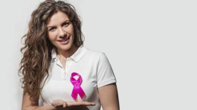healthcare, medicine and breast cancer concept - woman in blank t-shirt with pink cancer ribbon