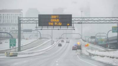 Ice and snow cover Interstate 93 through the city during Winter Storm Harper in Boston, Massachusetts on January 20, 2019. (Photo by Joseph PREZIOSO / AFP)