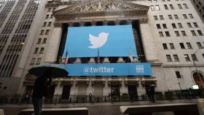 (FILES) This file photo taken on November 7, 2013 shows a banner with the logo of Twitter on the front of the New York Stock Exchange (NYSE) in New York. Twitter shares plummeted 19 percent October 6, 2016 following a report that Google has decided not to bid for the social media company. The big move down came after technology news site Recode said Google would not pursue a Twitter acquisition. Google had been seen by some observers as one of the more likely purchasers. / AFP PHOTO / EMMANUEL DUNAND