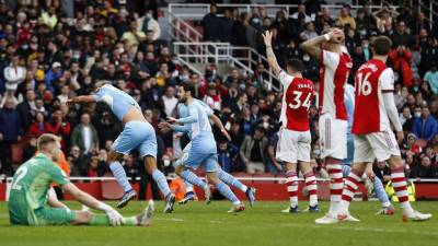 Jugadores del Manchester City celebrando el gol del triunfo marcado por Rodri.