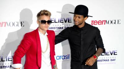 Justin Bieber y Usher en una foto de archivo.