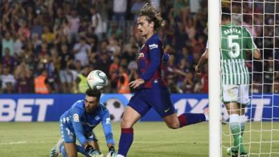 Barcelona's French forward Antoine Griezmann celebrates after scoring during the Spanish League football match between Barcelona and Real Betis at the Camp Nou stadium in Barcelona on August 25, 2019. (Photo by Josep LAGO / AFP)