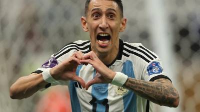 Argentina's midfielder #11 Angel Di Maria celebrates scoring his team's second goal during the Qatar 2022 World Cup final football match between Argentina and France at Lusail Stadium in Lusail, north of Doha on December 18, 2022. (Photo by Adrian DENNIS / AFP)