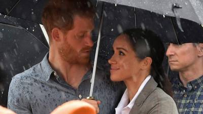 El príncipe Harry y Meghan Markle durante su visita a Australia. AFP.