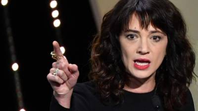Italian actress Asia Argento speaks on stage on May 19, 2018 during the closing ceremony of the 71st edition of the Cannes Film Festival in Cannes, southern France. Italian actress and sexual abuse campaigner Asia Argento denied on August 21, 2018 having had a sexual relationship five years ago with an underage teen. The New York Times reported on August 19, 2018 that Argento, a Harvey Weinstein accuser and leading figure in the #MeToo movement, had paid Jimmy Bennett $380,000 over the 2013 incident at a Los Angeles hotel. / AFP PHOTO / Alberto PIZZOLI