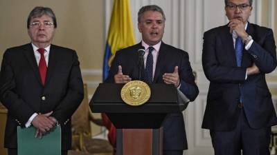 El presidente Ivan Duque junto al canciller colombiano Carlos Holmes Trujillo y el fiscal general colombiano Fernando Carrillo. AFP