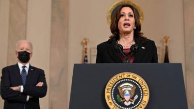(FILES) In this file photo taken on April 20, 2021 US President Joe Biden (L) listens as Vice President Kamala Harris delivers remarks on the guilty verdict against former policeman Derek Chauvin at the White House in Washington, DC. - President Joe Biden has hit some big targets in 100 days, starting with an epic effort to pull the United States from its Covid-19 nightmare, but headaches lie ahead. (Photo by Brendan SMIALOWSKI / AFP)