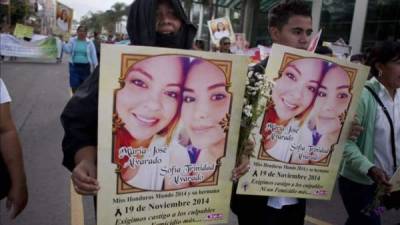 (Foto de archivo. Una protesta muestra el rostro de las hermanas Alvarado, asesinadas en Honduras).