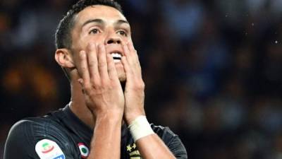 Juventus' Portuguese forward Cristiano Ronaldo reacts after missing a goal opportunity during the Italian Serie A football match Parma vs Juventus on September 1, 2018 at Ennio Tardini stadium in Parma. / AFP PHOTO / Andreas SOLARO