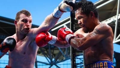 Pacquiao, que combina el combate con su actividad de senador, regresó a los rings en noviembre, después de siete meses fuera de ellos. /Manny Pacquiao (der.) y Jeff Horn (izq.)// Foto AFP/ Patrick HAMILTON