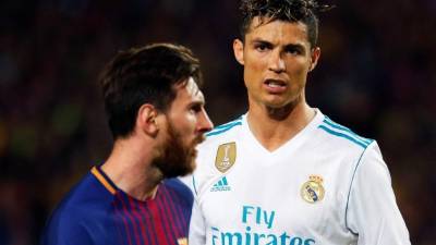 Lionel Messi y Cristiano Ronaldo anotaron un gol en el clásico. FOTO EFE/Alejandro García.