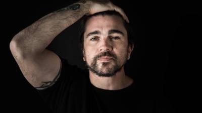 Colombian singer Juanes poses for a photograph after an interview with AFP on February 4, 2019 in Mexico City. - Colombian singer Juanes celebrated on Monday that many countries recognize opposition leader Juan Guaido as 'interim president' of Venezuela, and called for a peaceful democratic transition in that crisis-wracked South American country. (Photo by Omar TORRES / AFP)