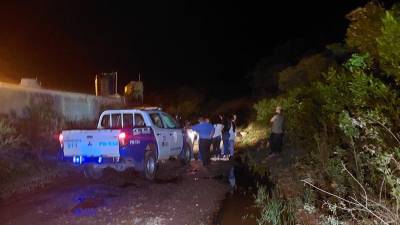 Patrulla de la Policías en la escena del crimen.