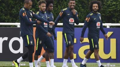 Brazil's Gabriel Jesus, center, waits for the referee to decide on the validity of his goal with teammates Roberto Firmino, left, and Philippe Coutinho, right, during a Copa America Group A soccer match at the Arena Fonte Nova in Salvador, Brazil, Tuesday, June 18, 2019. Referee Julio Bascunan, not in picture, annulled Gabriel Jesus' goal due to an offside position. Firmino and Coutinho also had goals disallowed during the match. (AP Photo/Natacha Pisarenko)