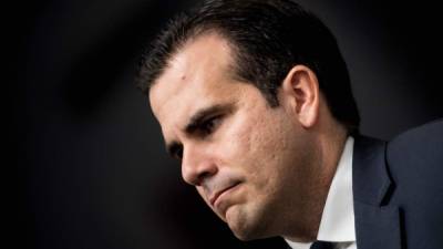 (FILES) In this file photo taken on January 10, 2018 Puerto Rico's Governor Ricardo Rossello listens during a press conference on Capitol Hill in Washington, DC. - Puerto Rico's Governor Ricardo Rossello announced on July 21, 2019 that he will not seek reelection next year after more than a week of protests demanding his resignation following the release of compromising chats. (Photo by Brendan Smialowski / AFP)