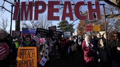 Manifestantes en Washington D.C. exigen la destitución de Trump de la presidencia de EEUU./AFP.