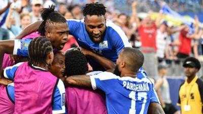 Martinique's Steeven Langil celebrates with teammates after scoring against Nicaragua during a Concacaf Gold Cup Group B match in Nashville, Tennessee, on July 8, 2017. / AFP PHOTO / NICHOLAS KAMM