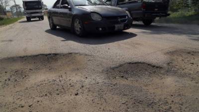 Así se ve el tramo carretero entre San Pedro Sula y Jucutuma. La cantidad de agujeros es in contable. Foto: Yoseph Amaya