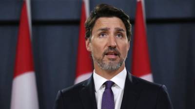 (FILES) In this file photo Canadian Prime Minister Justin Trudeau speaks during a news conference on January 9, 2020 in Ottawa, Canada. - Iran has said it will 'soon' send France the black boxes of a Ukrainian jetliner its forces mistakenly shot down in January, Canada's prime minister said June 16, 2020. 'The black boxes are supposed to be sent to France soon,' Prime Minister Justin Trudeau told a daily briefing, adding that the coronavirus pandemic had delayed the handover. 'We're going to continue to put pressure on the Iranian regime alongside our international partners to get answers, to get justice, to get compensation for the families,' he said. (Photo by Dave Chan / AFP)