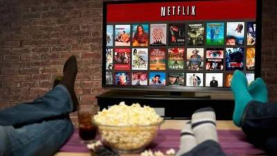 (FILES) In this file photo taken on June 28, 2019 the Netflix logo is seen on the backdrop of Netflix's 'Stranger Things 3' premiere at Santa Monica high school Barnum Hall in Santa Monica, California. - How many hundreds of millions of dollars would you pay for reruns of 'Friends,' the American version of 'The Office' or 'The Big Bang Theory'?If you are a streaming powerhouse, the answer is: quite a few.As online video platforms jockey for position with new rivals for audience share, classic television series are commanding hefty sums. (Photo by Chris Delmas / AFP)