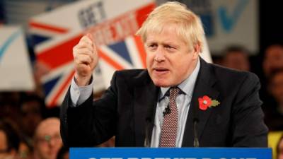 (FILES) In this file photo taken on November 06, 2019 Britain's Prime Minister Boris Johnson speaks at the Conservative Party's General Election campaign launch, at the National Exhibition Centre (NEC) in Birmingham, central England. - Britain is set to leave the European Union at 2300 GMT on January 31, 2020, 43 months after Britons voted in the June 2016 referendum to leave the EU, ending more than four decades of economic, political and legal integration with its closest neighbours. (Photo by Adrian DENNIS / AFP)