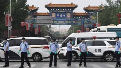 China detecta un nuevo brote de coronavirus relacionado con el principal mercado de Pekín. AFP