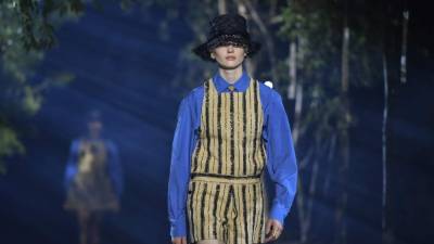 A model presents a creation by Maison Dior during the Women's Spring-Summer 2020 Ready-to-Wear collection fashion show at the Hippodrome de Longchamps in Paris, on September 24, 2019. (Photo by Christophe ARCHAMBAULT / AFP)