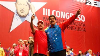 El exjefe de la inteligencia militar Hugo Carvajal posa junto al presidente de Venezuela, Nicolás Maduro. Foto: AFP/Archivo