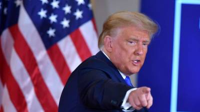 (FILES) In this file photo US President Donald Trump gestures after speaking during election night in the East Room of the White House in Washington, DC, early on November 4, 2020. - Two months before he is due to leave office, President Donald Trump asked top aides about the possibility of striking Iran's nuclear facilities, The New York Times reported on November 16, 2020. During a meeting at the Oval Office last November 12, 2020, the outgoing Republican leader asked several top aides, including Vice President Mike Pence, Secretary of State Mike Pompeo and the chairman of the Joint Chiefs, General Mark Milley, 'whether he had options to take action against Iran's main nuclear site in the coming weeks,' the newspaper said. (Photo by MANDEL NGAN / AFP)