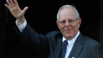 (FILES) In this file picture taken on March 10, 2018 Peruvian President Pedro Pablo Kuczynski waves to the press upon arriving at the Diplomatic Academy in Santiago for a meeting with Chile's President-elect Sebastian Pinera, on the eve of the latter's inauguration.Peru President Pedro Pablo Kuczynski, accused of bribe-taking in the Brazilian construction giant Odebrecht scandal, announced his resignation on March 21, 2018 after the opposition alleged the embattled president was trying to buy votes ahead of an impeachment ballot. / AFP PHOTO / CLAUDIO REYES