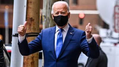 Biden impondrá por ley el uso de la mascarilla en el transporte público y aéreo en Estados Unidos./AFP.