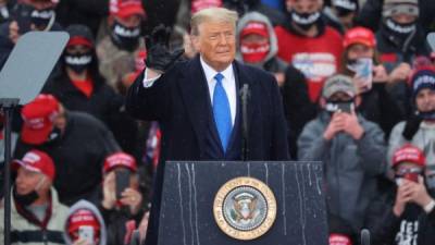 LANSING, MICHIGAN - OCTOBER 27: U.S. President Donald Trump addresses thousands of supporters during a campaign rally at Capital Region International Airport October 27, 2020 in Lansing, Michigan. With one week until Election Day, Trump is campaigning in Michigan, a state he won in 2016 by less than 11,000 votes, the narrowest margin of victory in the state's presidential election history. Chip Somodevilla/Getty Images/AFP