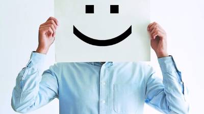 Career happiness with employee holding a blank paper and a smiley
