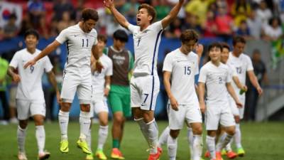 Jugadores de Corea del Sur celebrando su clasificación a cuartos. Foto AFP