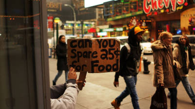 NEW YORK, NY - DECEMBER 04: A person in economic difficulty holds up a homemade sign asking for money along a Manhattan street where dozens of panhandlers are viewed daily on December 4, 2013 in New York City. According to a recent study by the by the United States Department of Housing and Urban Development, New York CityÕs homeless population increased by 13 percent at the beginning of this year. Despite an improving local economy, as of last January an estimated 64,060 homeless people were in shelters and on the street in New York. Only Los Angeles had a larger percentage increase than New York for large cities. Spencer Platt/Getty Images/AFP== FOR NEWSPAPERS, INTERNET, TELCOS & TELEVISION USE ONLY ==